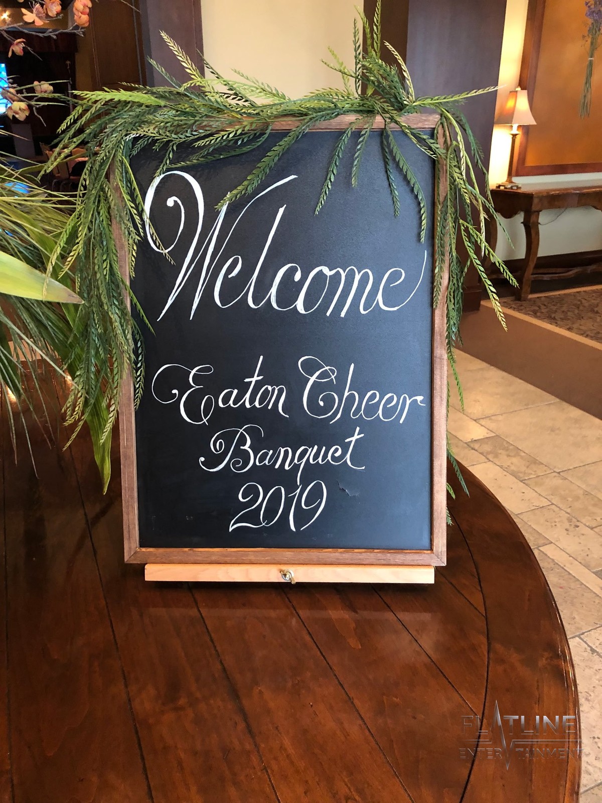 A decorated chalkboard sign reading Welcome Eaton Cheer Banquet 2019