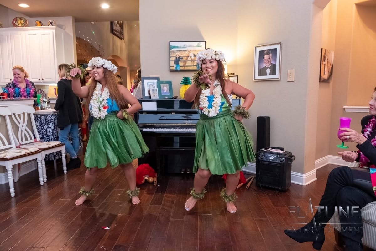 Guests learning the moves from the hula dancers at a birthday party